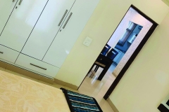 Spacious Bedroom with LED Panel & View of Dining Area – Home Brothers Interiors