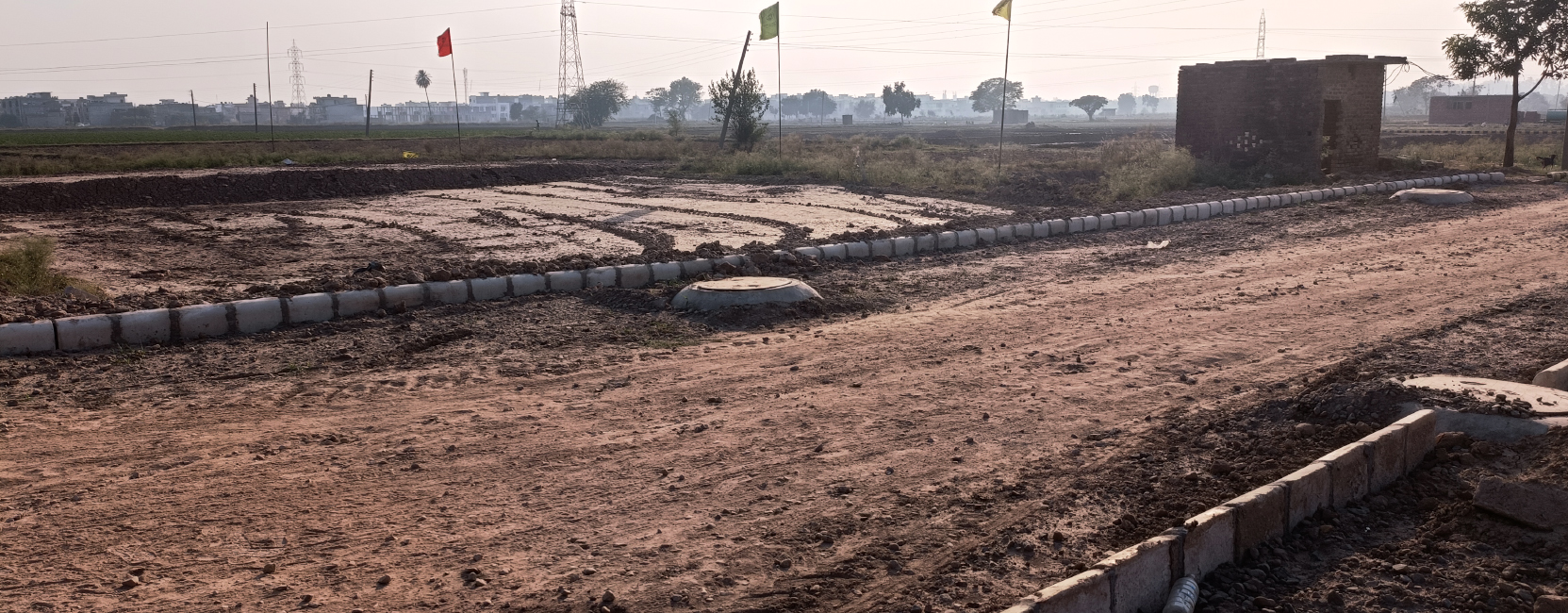 Wide Internal Road – Home Brothers Gated Community, Kharar Wide, clean internal road with greenery in a Home Brothers residential project in Kharar