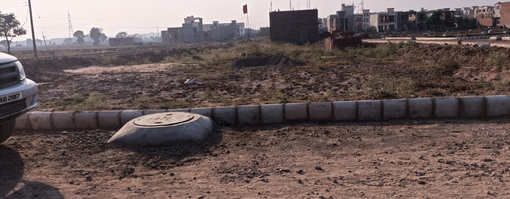 Front View – Residential Open Land for Sale in Kharar Front view of open plot land in a Home Brothers real estate project in Kharar