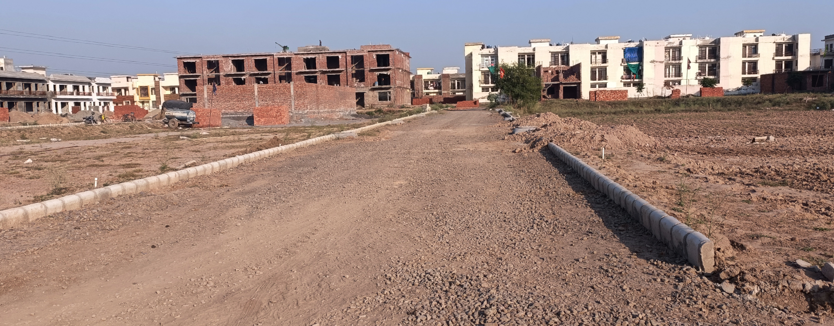 Spacious Internal Road – Home Brothers Gated Society, Kharar Wide internal road with street lighting inside Home Brothers residential project in Kharar